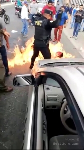 man-beating-mob-douse-gasoline-set-on-fire-front-cop.jpg